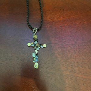 beaded cross on black braided cord